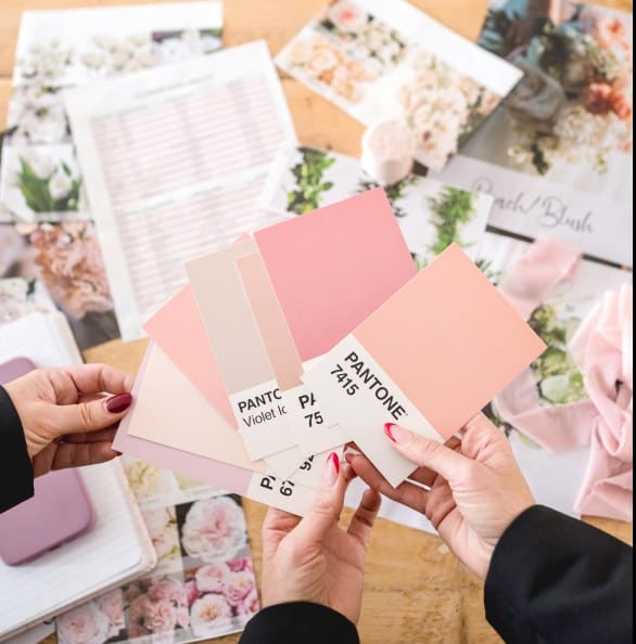 Pink and beige Pantone color swatches for floral arrangements.