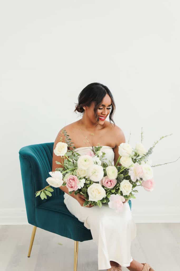 Beautiful bridal bouquet with white and pink roses and greenery.
