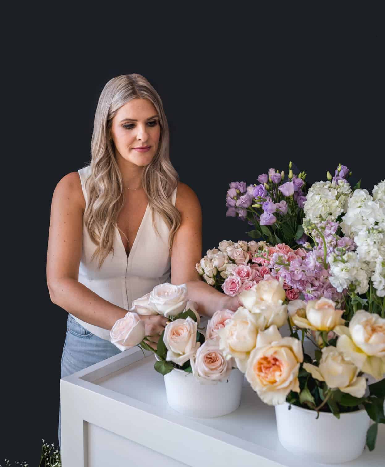 Beautiful floral arrangement with roses and hydrangeas for events.