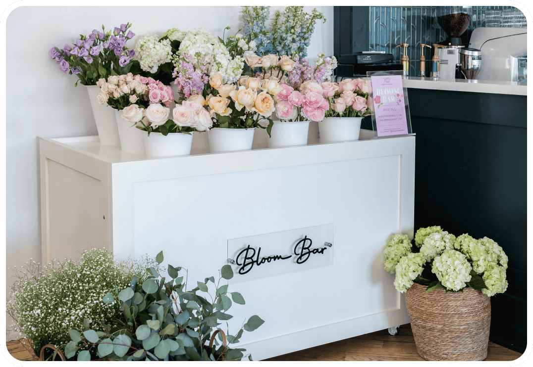 Beautiful floral arrangements at XO Flowers Bloom Bar in pastel colors.