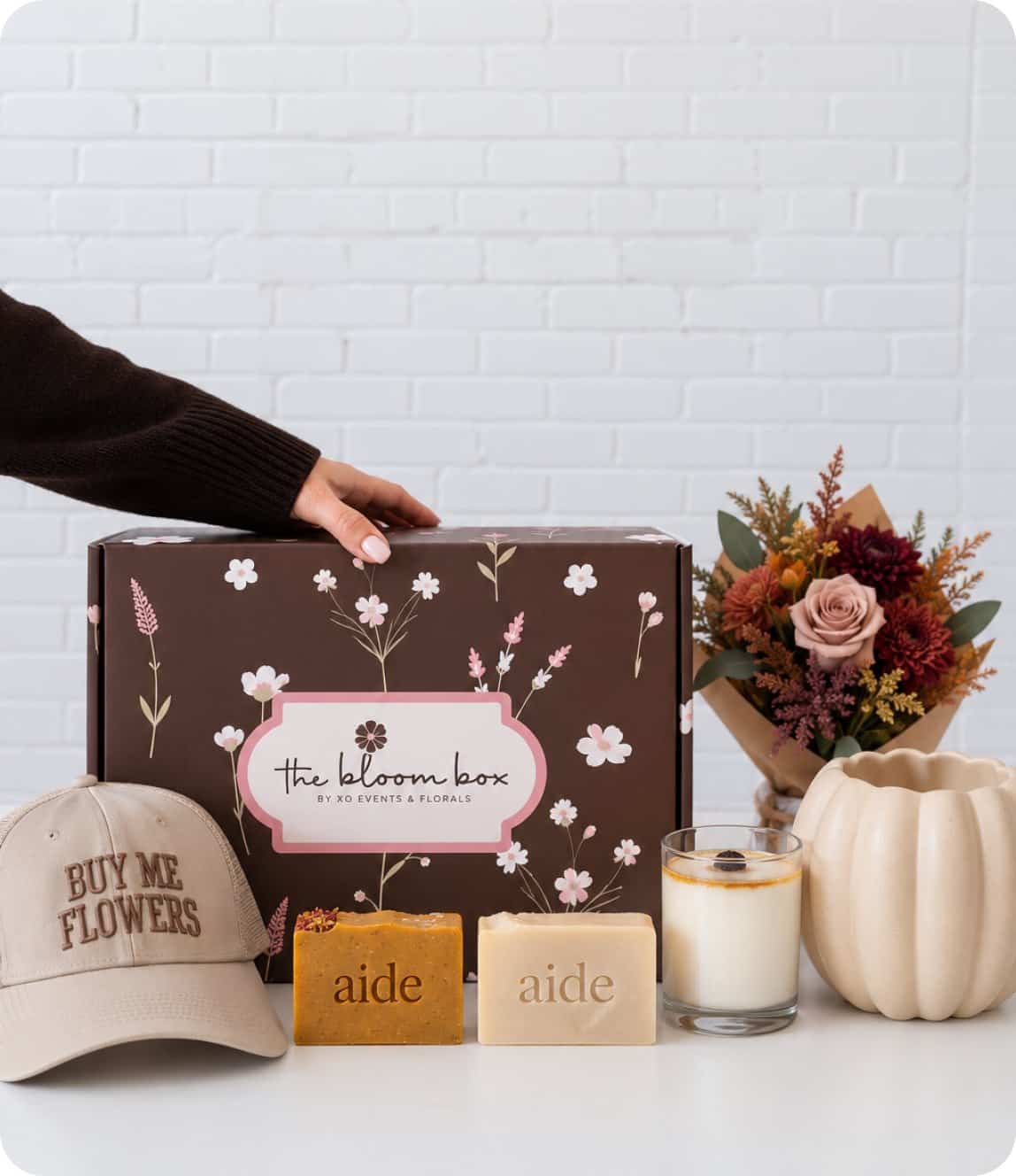 Elegant floral arrangement kit with flowers, candles, and accessories from XO Flowers.
