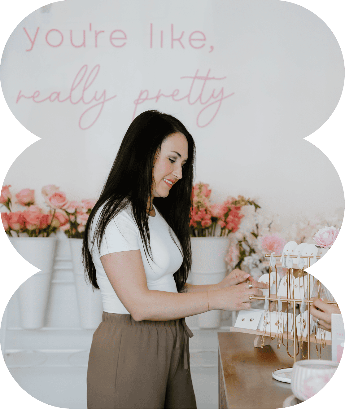 Woman shopping for jewelry at XO Flowers floral shop.